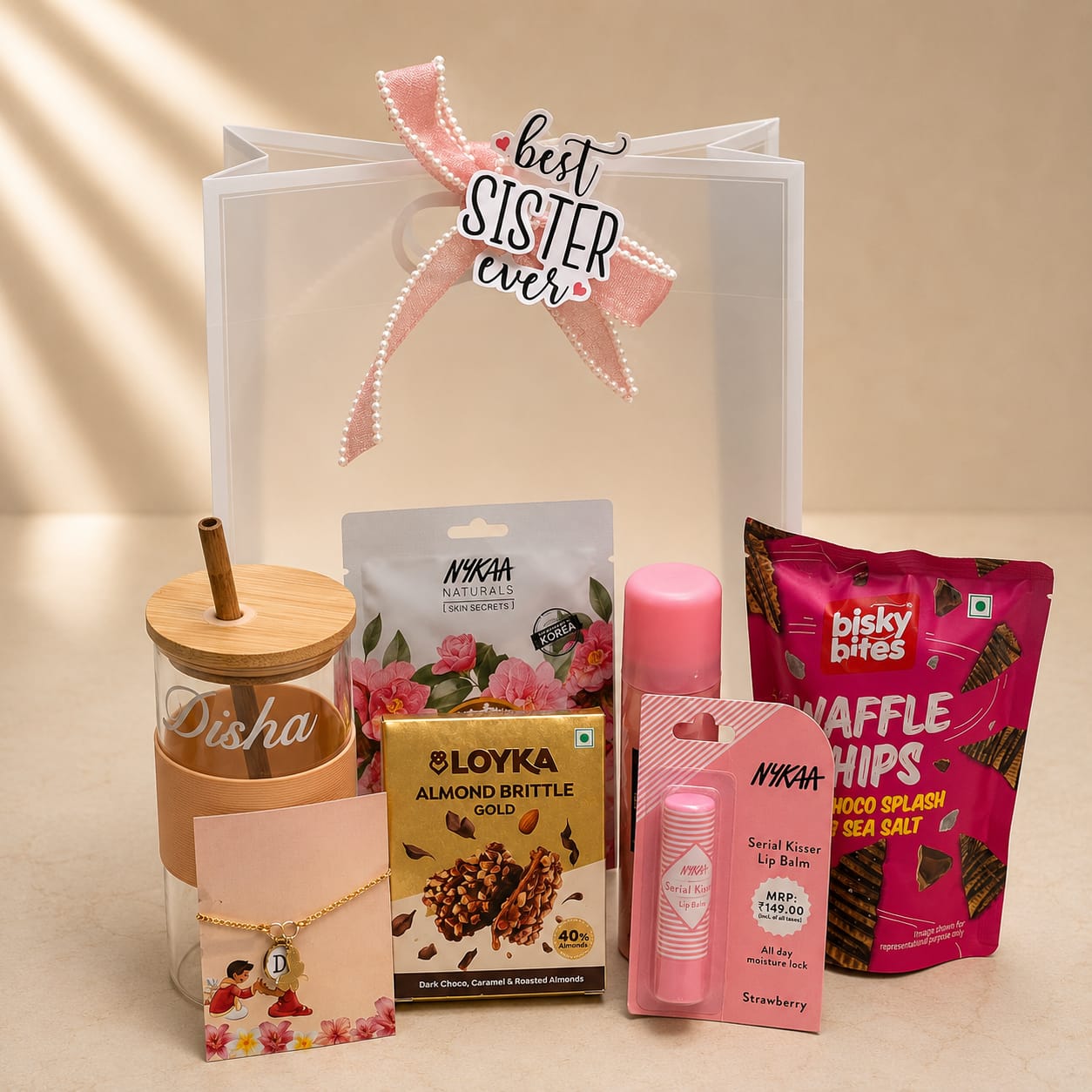 Personalized Blush Rakhi Gift Hamper for Sister with Custom Glass Sipper, Beauty Essentials, Chocolates, Snacks and Rakhi Bracelet