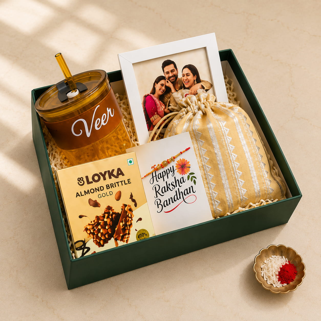 Personalized Delight Rakhi Gift Hamper for Brother with custom tumbler, photo frame, Loyka almond brittle, dry fruit potli and designer rakhi.