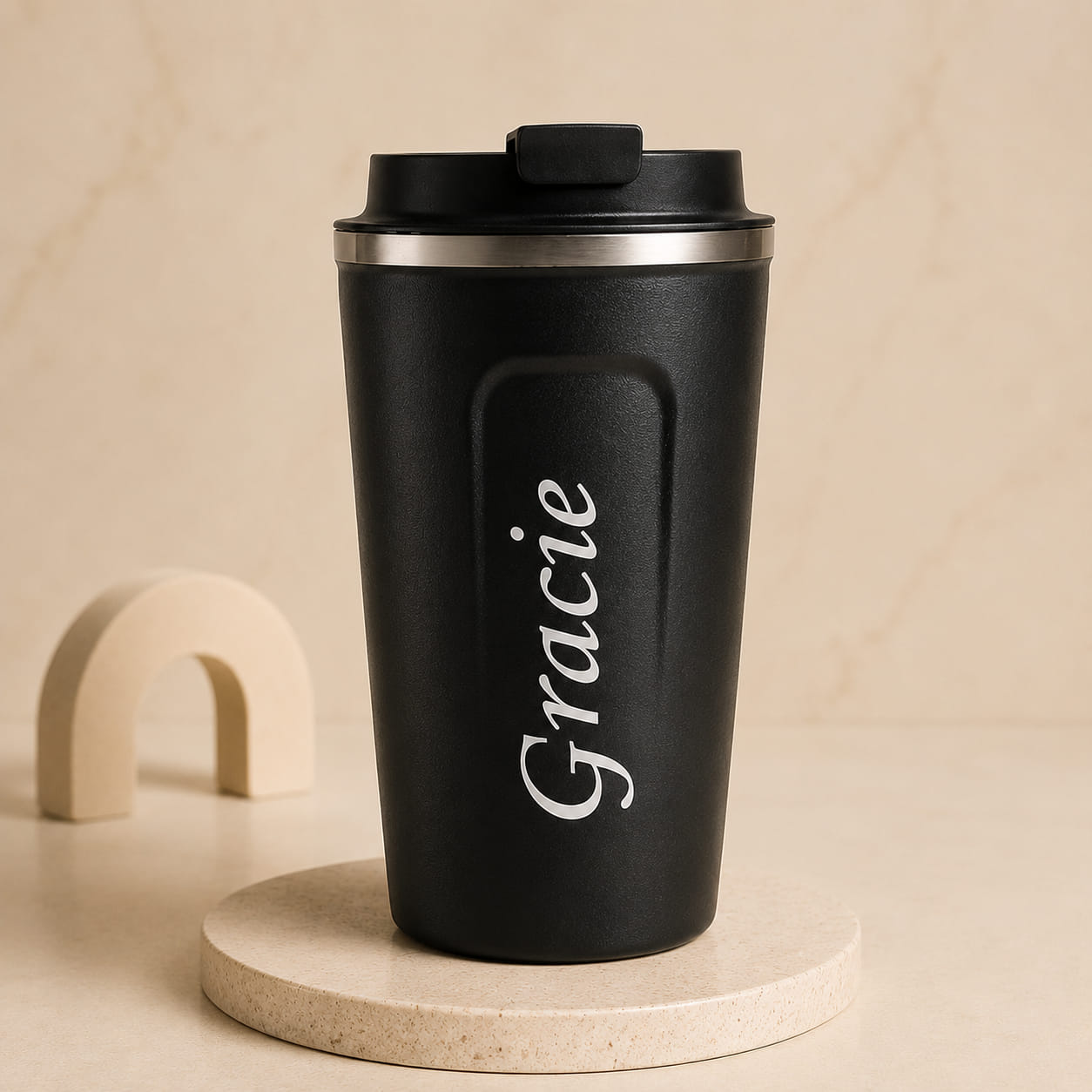 Personalized stainless steel travel coffee mug with custom name and insulated lid.