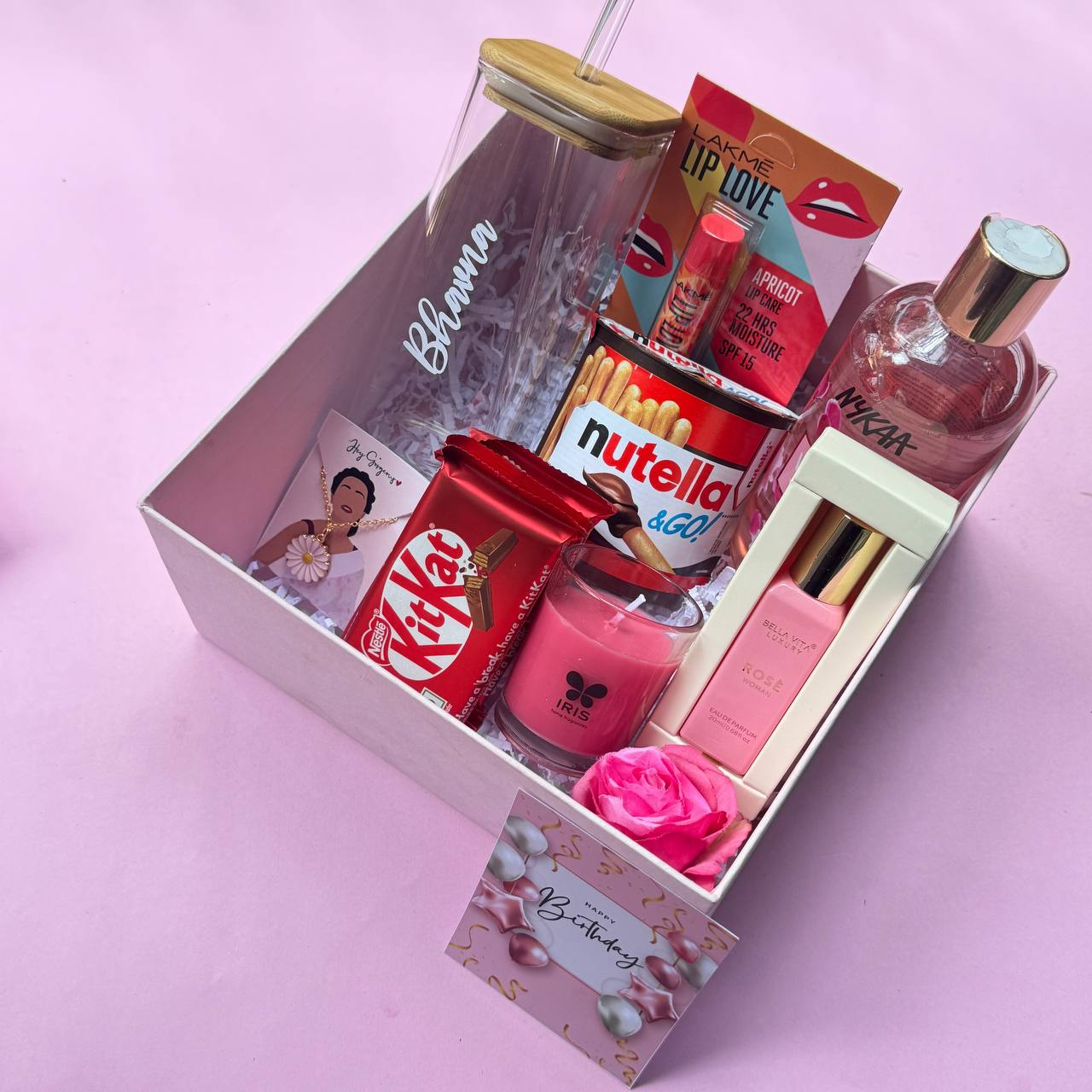 Blush Blossom birthday gift hamper for her with personalized tumbler, chocolates, beauty products, and premium gift box.