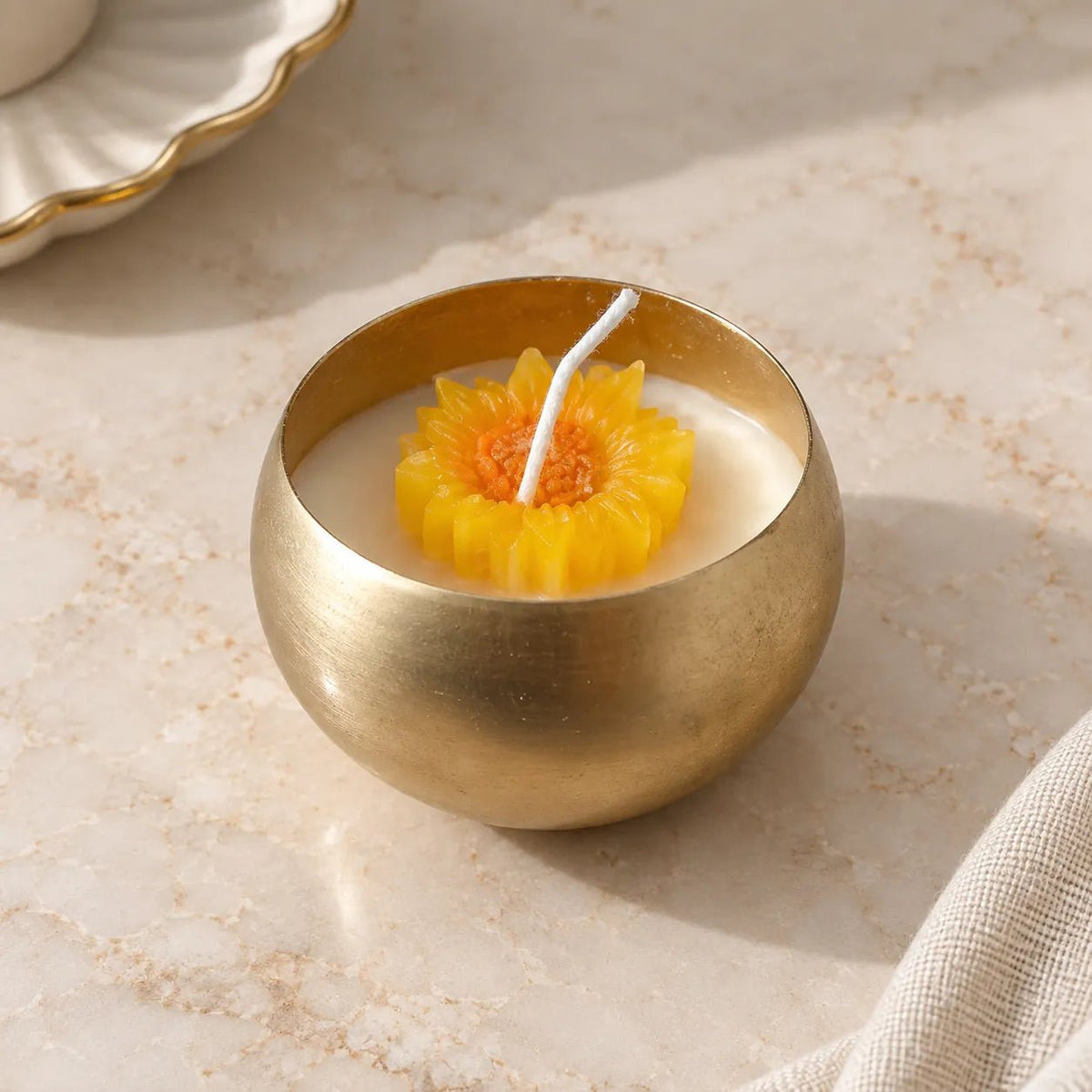 Bowl Urli Jar Candle with golden bowl and sunflower floral centre