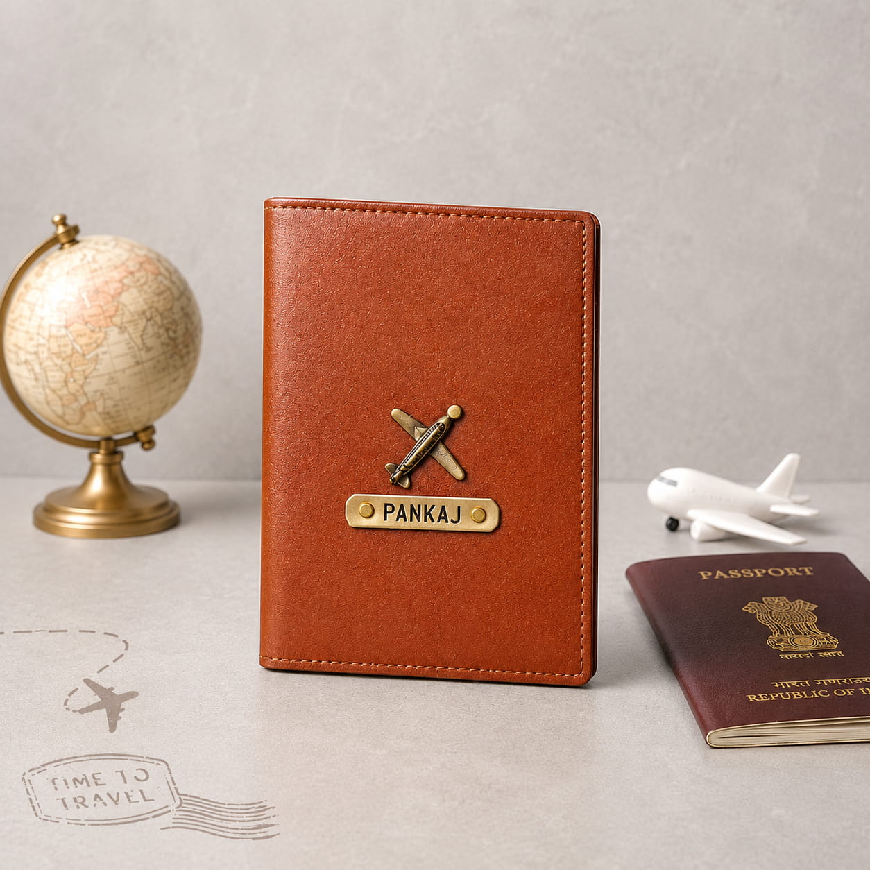 Personalized brown passport cover with custom name plate and airplane charm