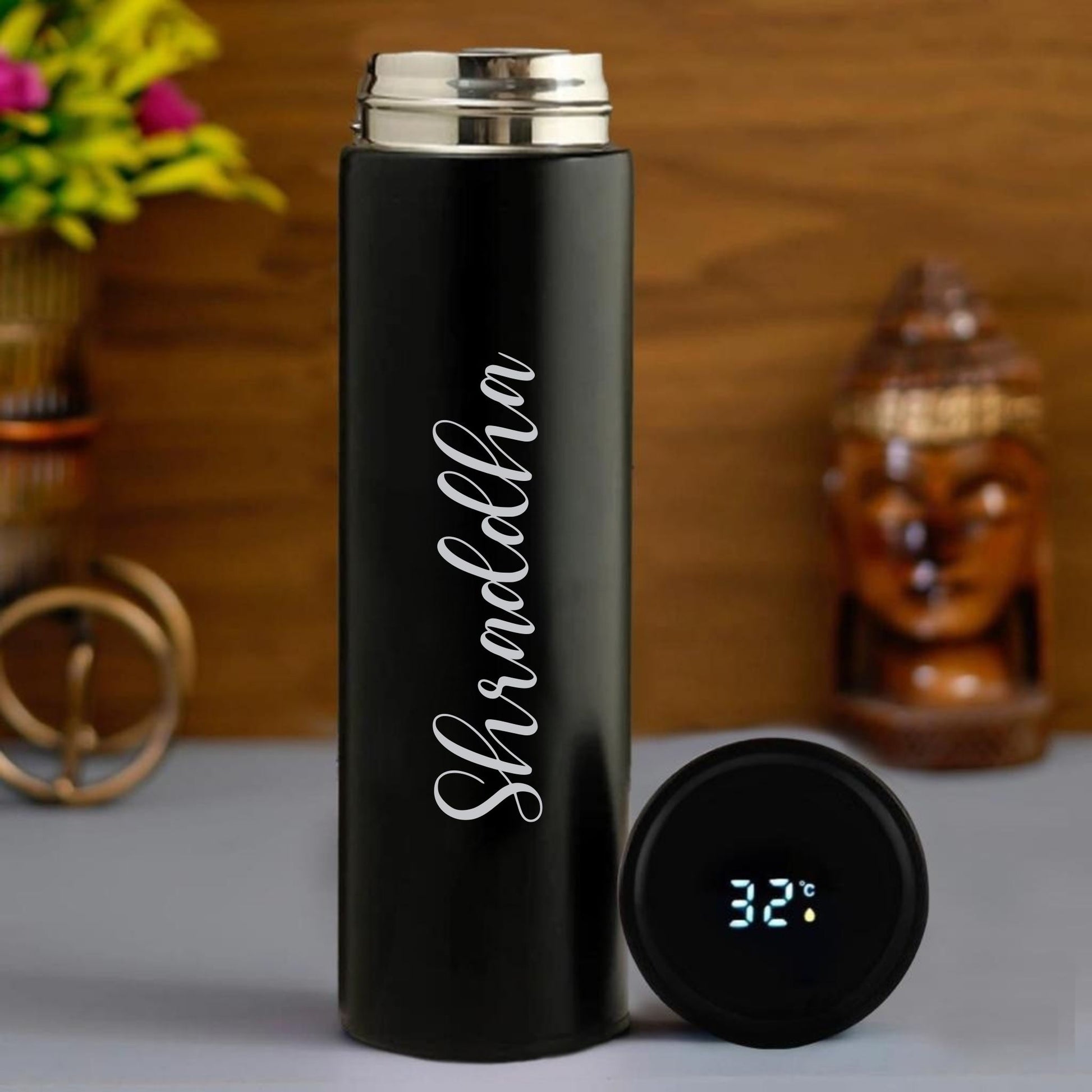 Personalized black LED temperature bottle with digital temperature display cap and custom name engraving.