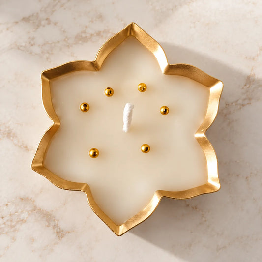 Handmade Lotus Urli Candle with golden border and decorative moti accents