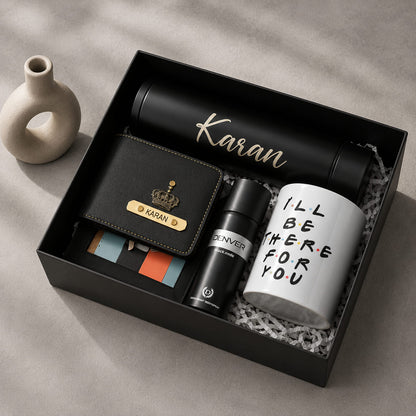 Personalized executive gift hamper for men with custom wallet, insulated bottle, coffee mug, and premium black gift box.