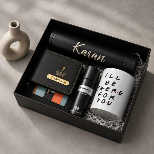 Personalized executive gift hamper for men with custom wallet, insulated bottle, coffee mug, and premium black gift box.