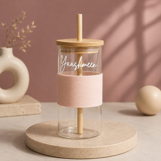 Personalized glass tumbler with bamboo lid, reusable straw and silicone grip sleeve customized with name.