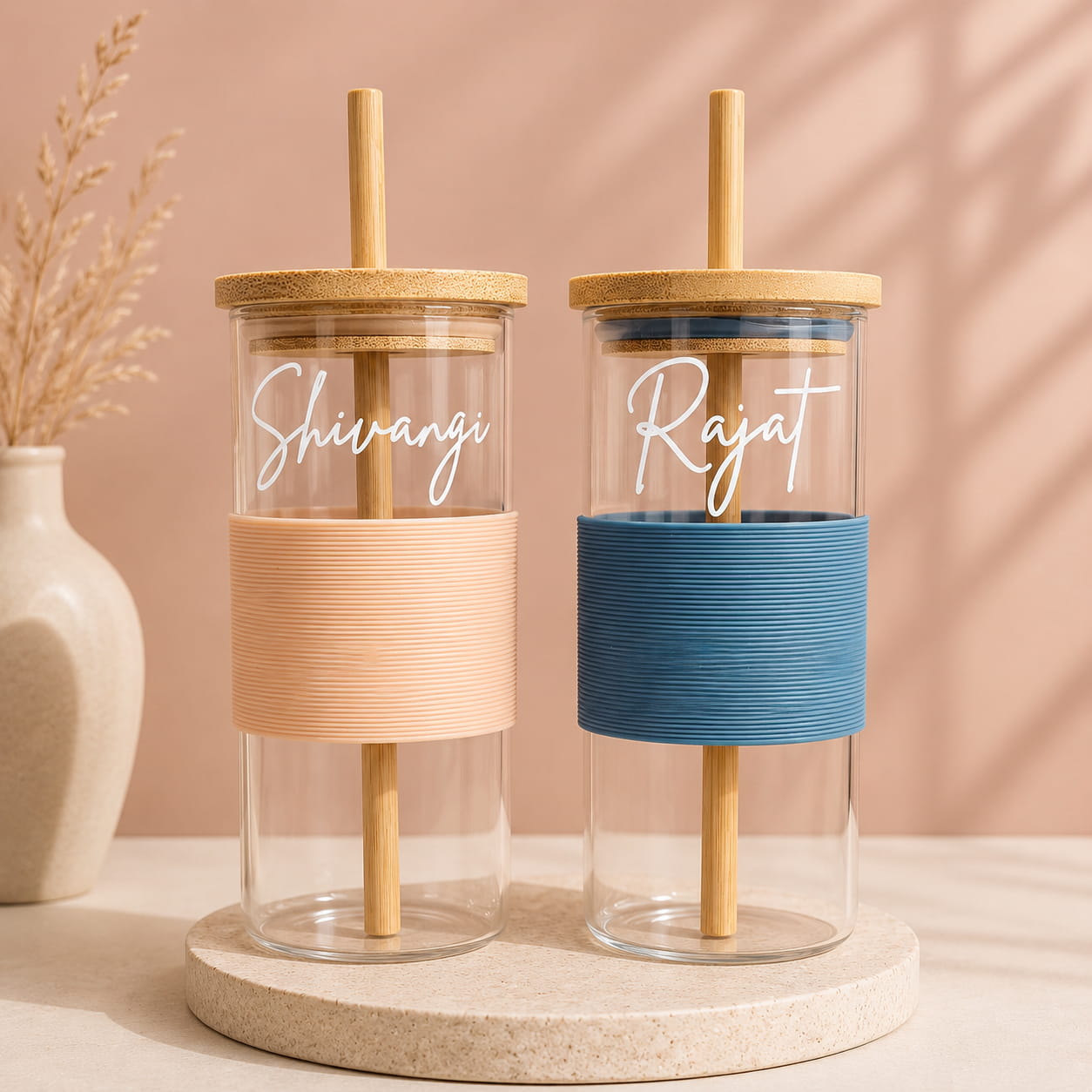 Personalized glass tumbler with bamboo lid, reusable straw and silicone grip sleeve customized with name.