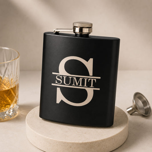 Personalized stainless steel hip flask with custom name engraving.