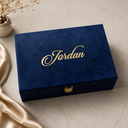 Personalized luxury men's gift hamper with velvet trunk box, custom wallet, passport cover, glass tumbler, keychain and premium gifting essentials.