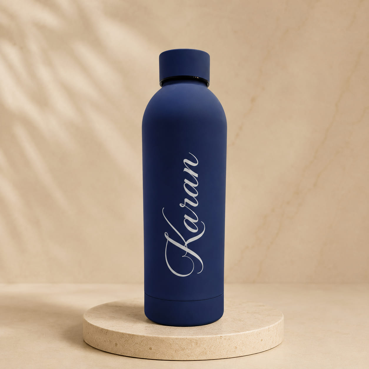 Personalized matte insulated water bottle customized with name in multiple colors.
