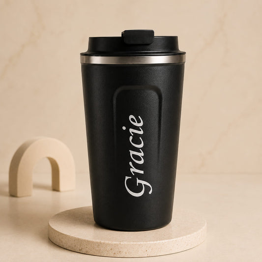 Personalized stainless steel travel coffee mug with custom name and insulated lid.