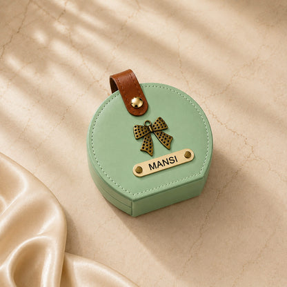 Personalized mini travel jewelry box organizer in multiple colors including Mint Green, Baby Pink, Cream, Black, Baby Blue, Hot Pink, and Peach with custom name and charm.