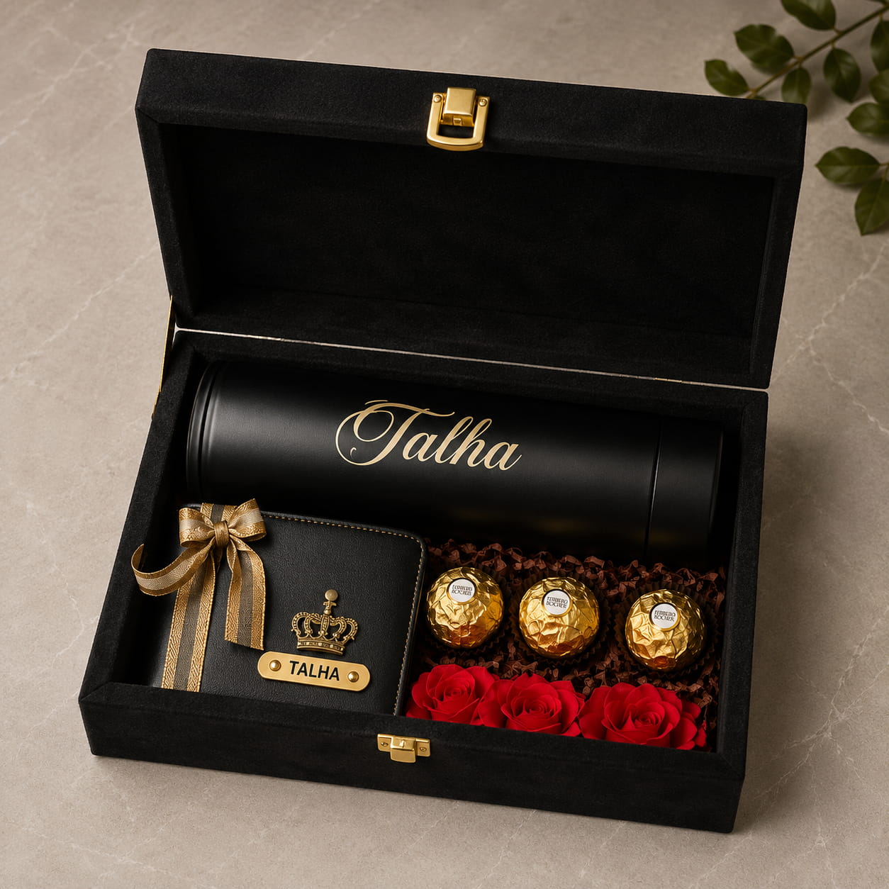 Personalized Velvet Trunk Gift Hamper with customized velvet trunk box, LED temperature bottle, men's wallet, Ferrero Rocher chocolates and artificial roses.