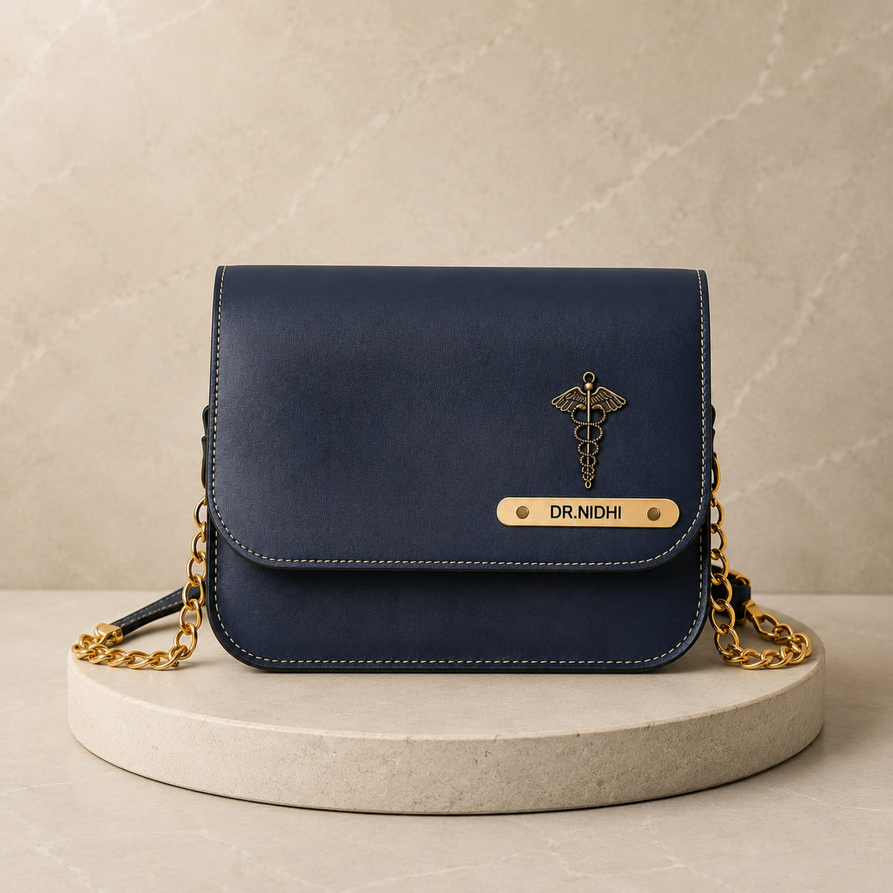 Personalized navy blue women's sling bag with custom name plate and medical charm