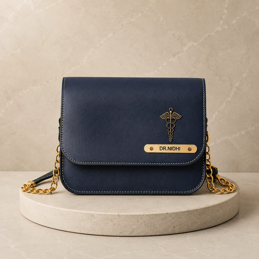 Personalized navy blue women's sling bag with custom name plate and medical charm