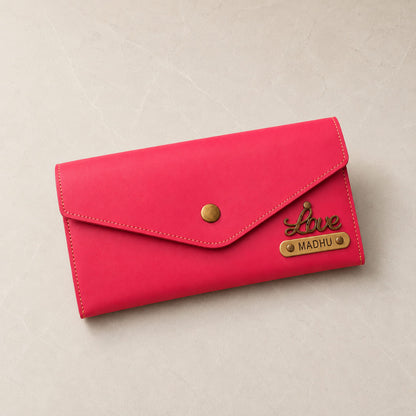 Pink personalized women's clutch wallet with custom name plate and love charm
