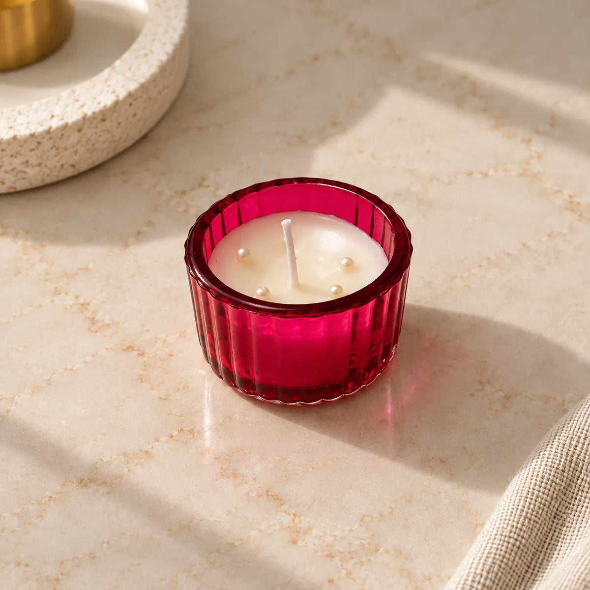 Red Ribbed Glass Candle with cream wax and pearl accents
